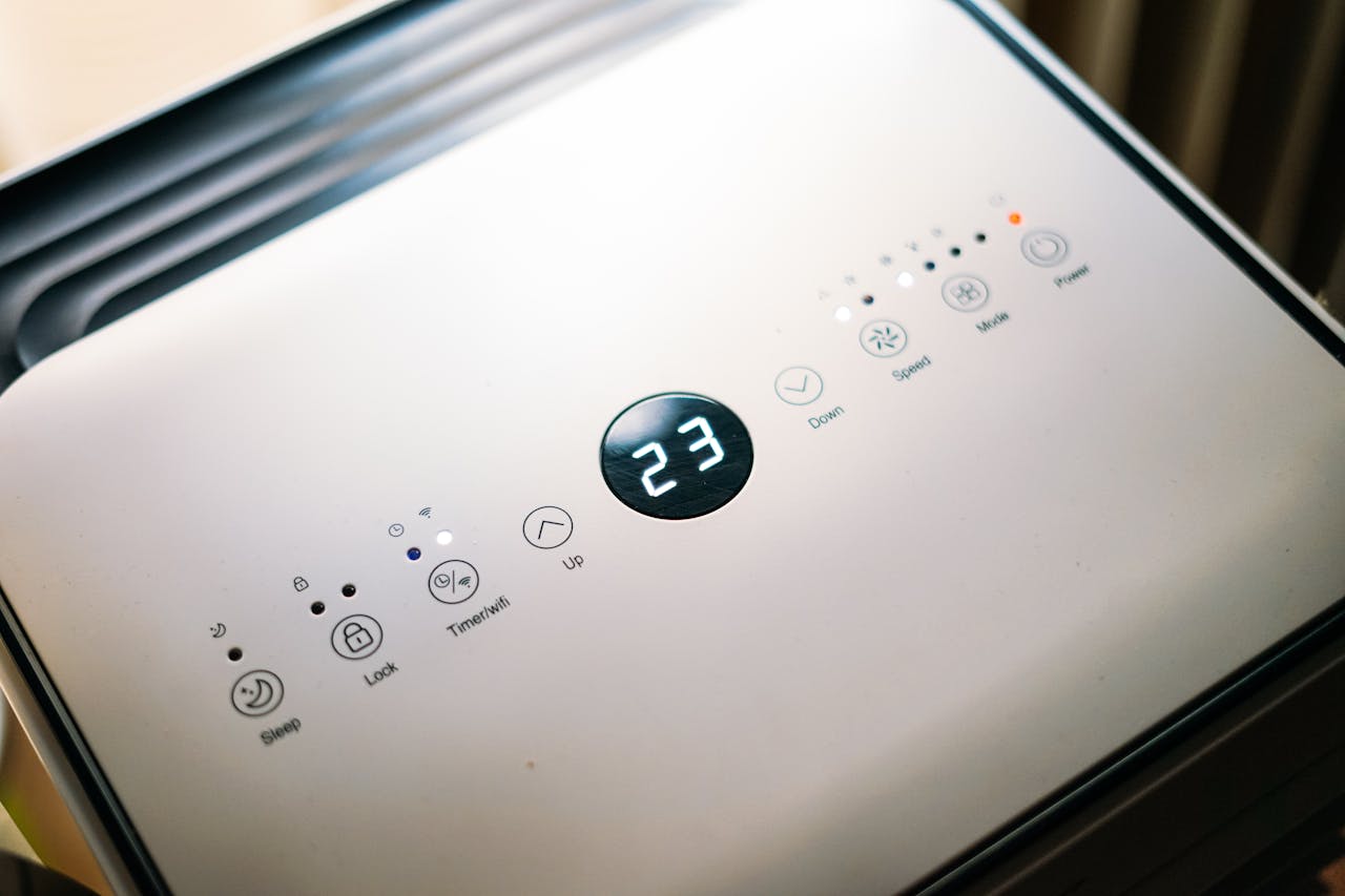 Home Close-up of a sleek air conditioner control panel displaying temperature.