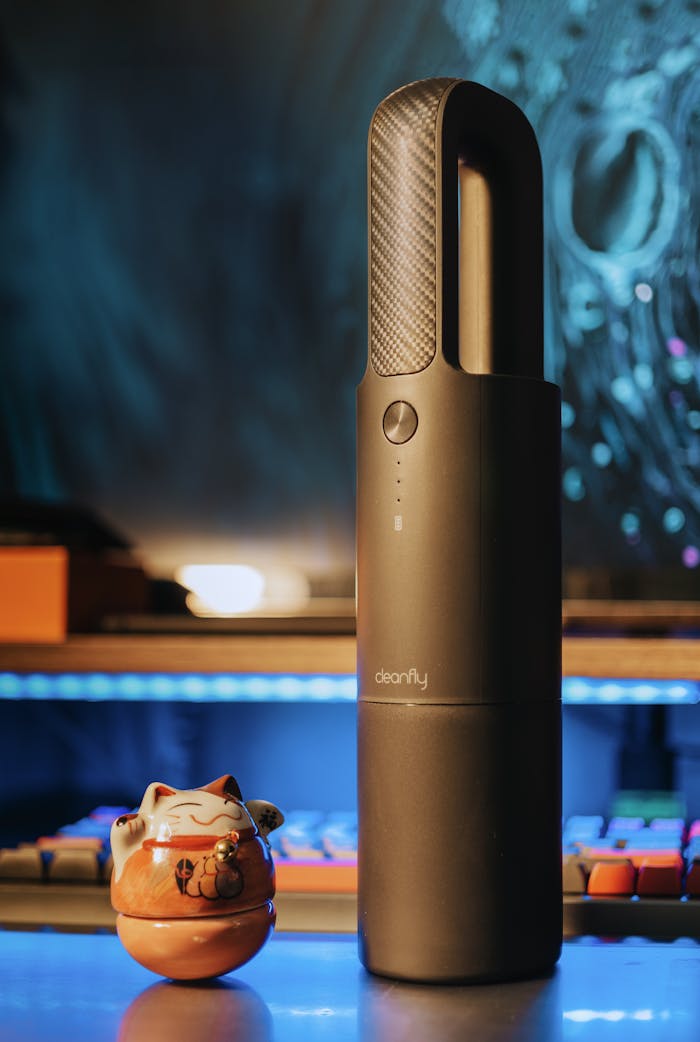 Home Stylish black wireless vacuum displayed in a contemporary setting, perfect for modern households.