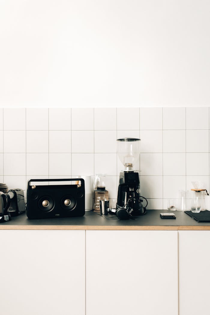 Home Stylish kitchen setup with a coffee maker and sleek design elements on a minimalist counter.