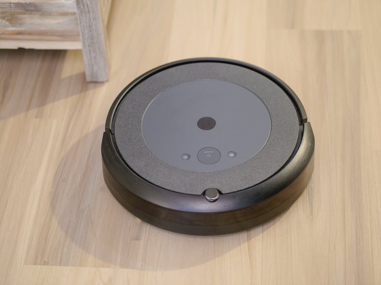 Home High-tech robotic vacuum cleaner efficiently cleaning modern floor indoors.